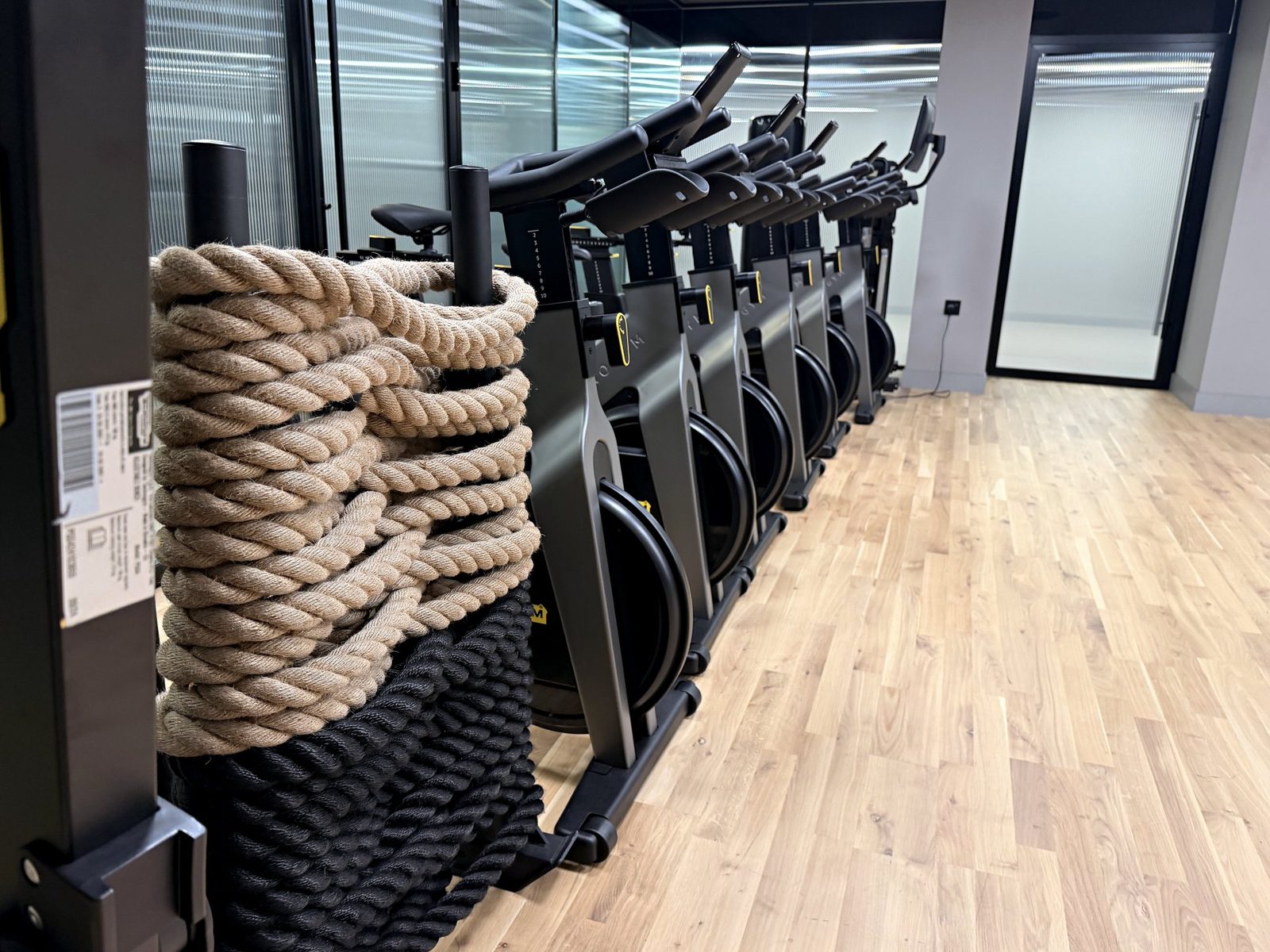 Battle ropes and bikes in the gym